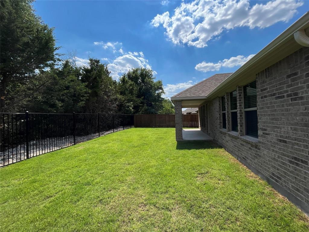 1420 Elizabeth Street Anna, TX 75409 - Photo 16 of 18 a view of a backyard with a garden