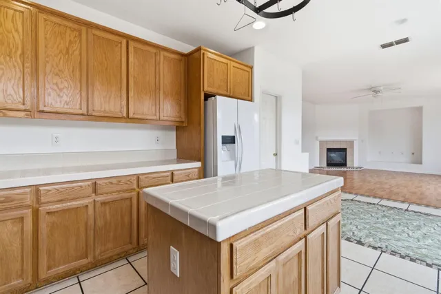 a kitchen with a stove a sink and a microwave