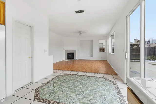 a kitchen with stainless steel appliances granite countertop a refrigerator sink and cabinets
