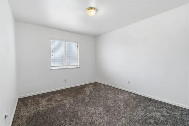 a view of a hallway with stairs