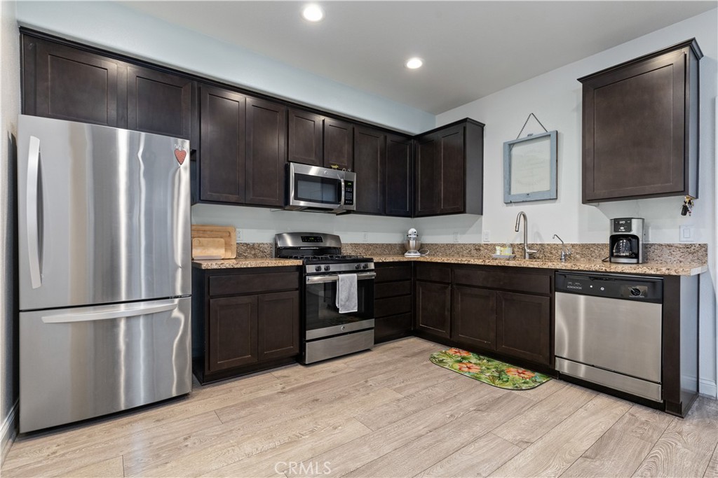 9354 Riberena Circle Atascadero, CA 93422 - Photo 7 of 47 a kitchen with a refrigerator stove and sink