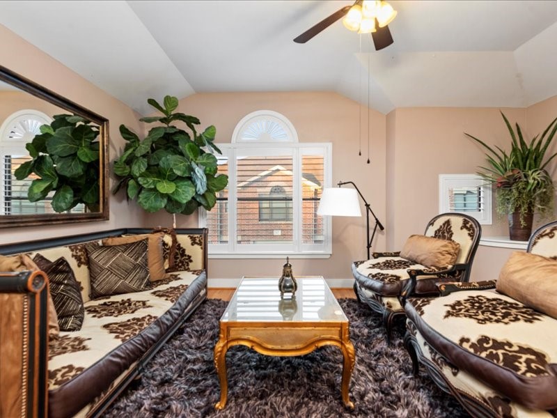 5941 South Loop E Freeway, Unit 504 Houston, TX 77033 - Photo 17 of 39 a living room with furniture fireplace and a large window