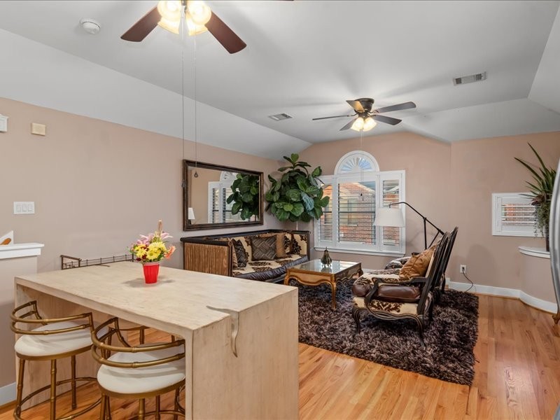 5941 South Loop E Freeway, Unit 504 Houston, TX 77033 - Photo 25 of 39 a view of a dining room with furniture a chandelier and wooden floor