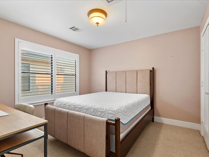5941 South Loop E Freeway, Unit 504 Houston, TX 77033 - Photo 27 of 39 a bedroom with a bed and a window