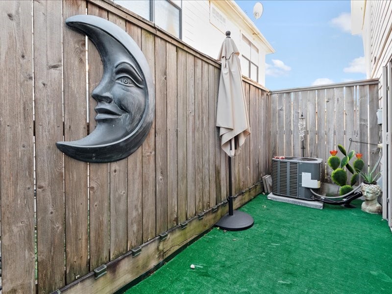 5941 South Loop E Freeway, Unit 504 Houston, TX 77033 - Photo 31 of 39 a view of a backyard with wooden fence and a stairs