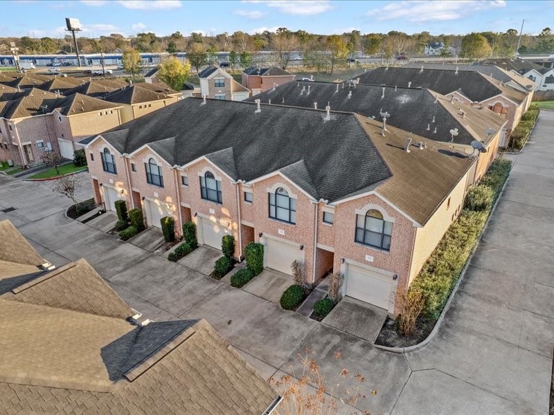 5941 South Loop E Freeway, Unit 504 Houston, TX 77033 - Photo 34 of 39 an aerial view of a house with a yard