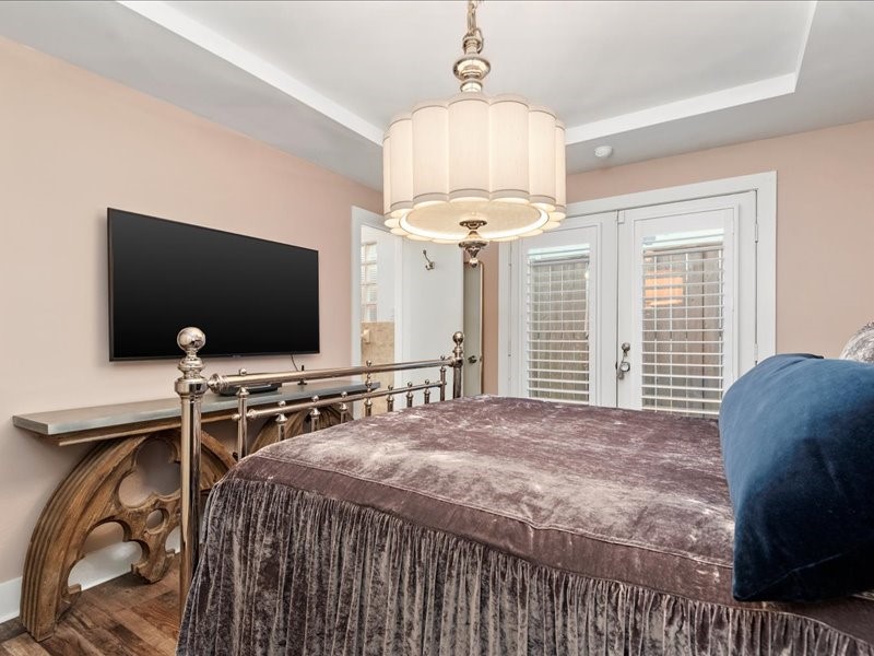 5941 South Loop E Freeway, Unit 504 Houston, TX 77033 - Photo 10 of 39 a bedroom with bed and a flat screen tv