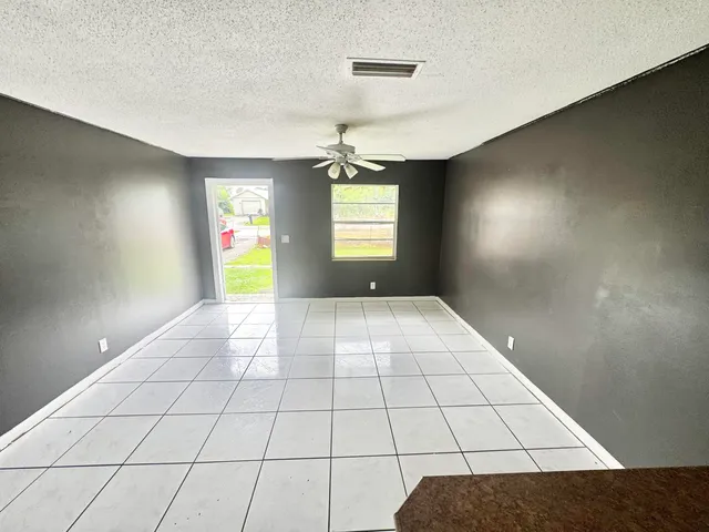 a view of an empty room and window