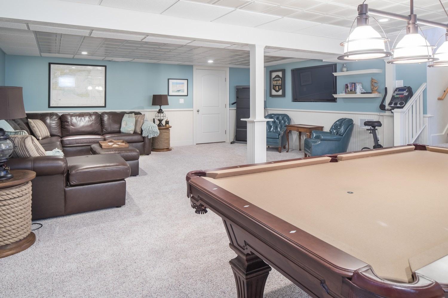 30 Barnard Road Osterville, MA 02655 - Photo 16 of 18 a living room with furniture a flat screen tv and kitchen view