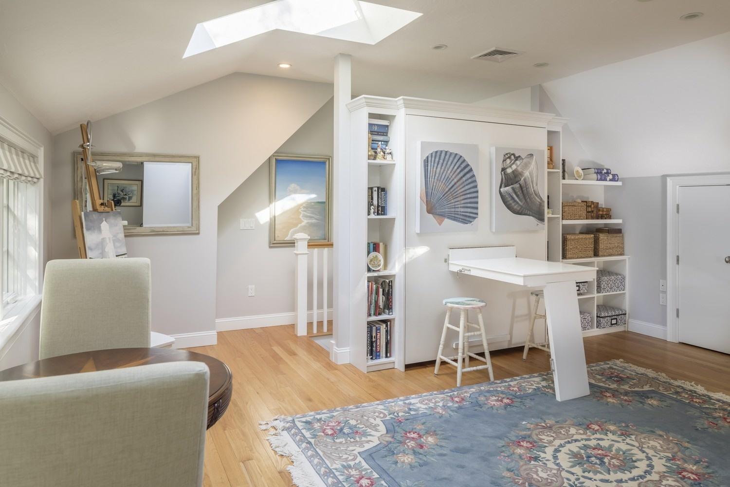 30 Barnard Road Osterville, MA 02655 - Photo 17 of 18 a living room with furniture and a table