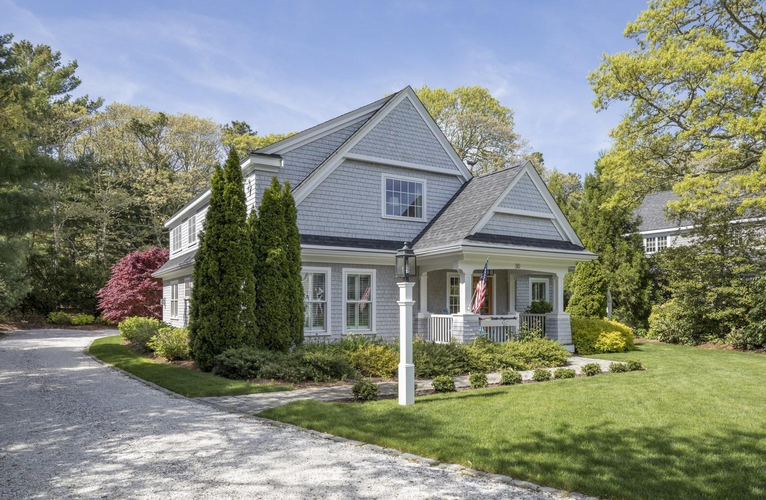 30 Barnard Road Osterville, MA 02655 - Photo 2 of 18 a front view of a house with a yard