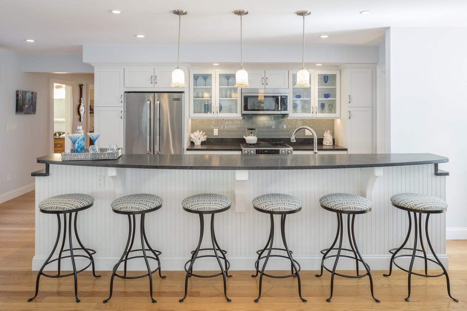 30 Barnard Road Osterville, MA 02655 - Photo 7 of 18 a kitchen with cabinets and chairs