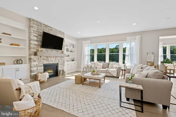 a living room with furniture fireplace and a flat screen tv