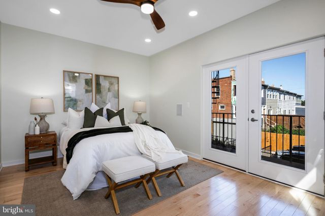 a bathroom with a sink mirror and toilet