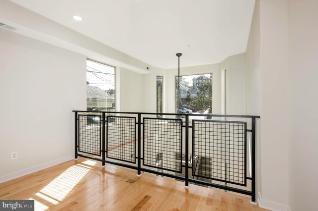 a view of hallway with balcony