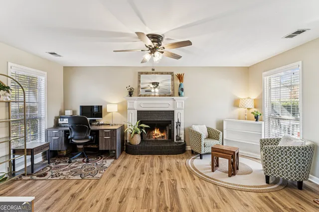 a living room with furniture and a fireplace