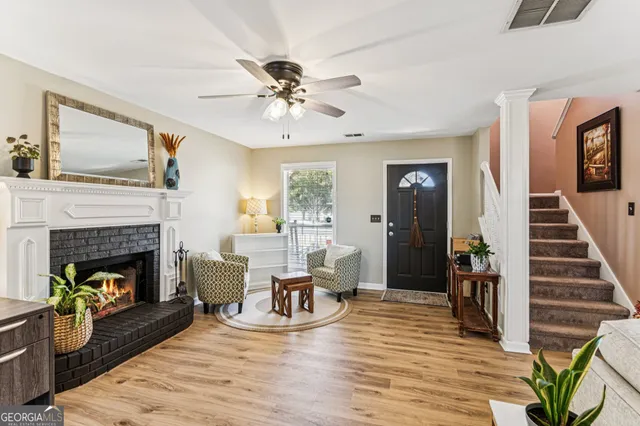 a living room with furniture and a fireplace