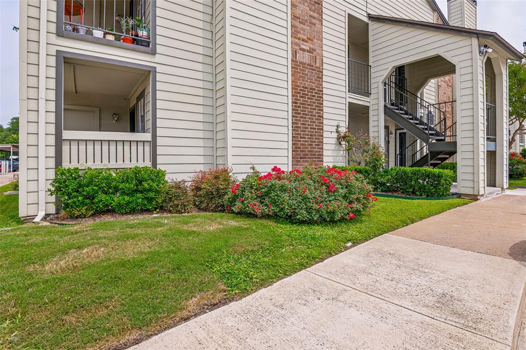5981 Arapaho Road, Unit 309 Dallas, TX 75248 - Photo 1 of 13 a view of a house with a yard and plants