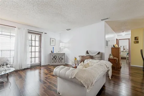 a bed room with bed and windows