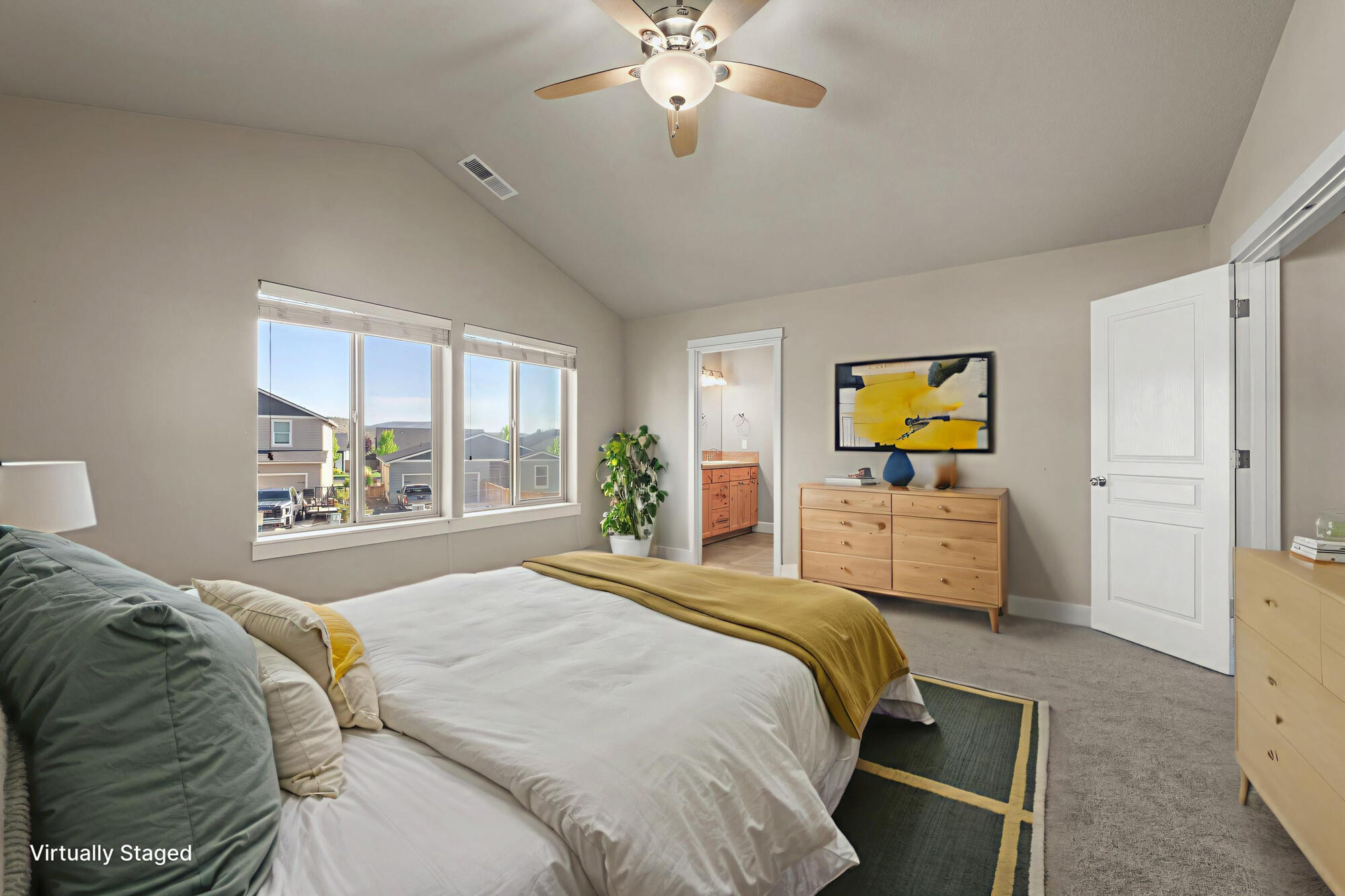 1402 Northeast Hudspeth Road Prineville, OR 97754 - Photo 16 of 36 a bedroom with a bed a chandelier and a flat tv screen