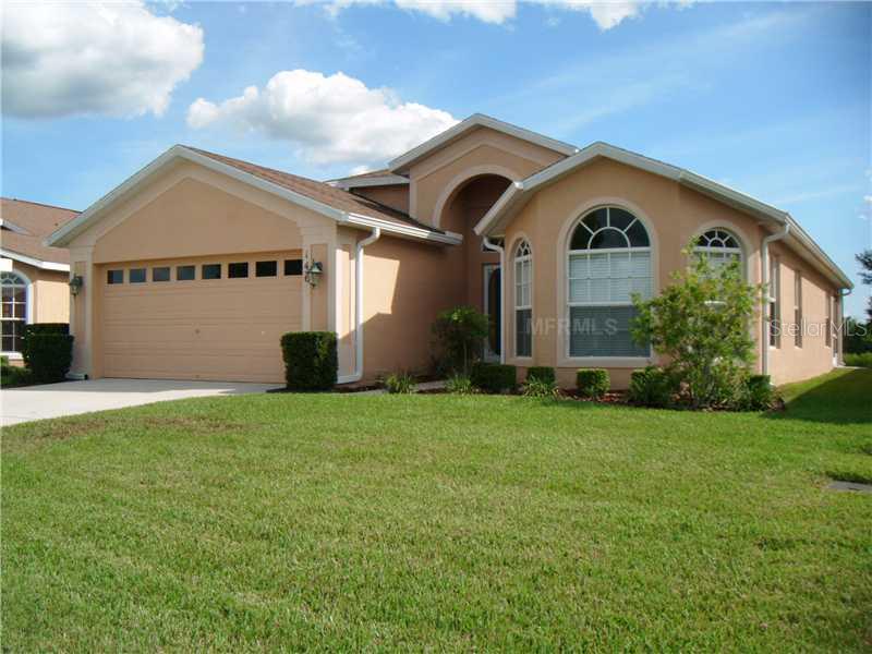146 Gordham Spring Hill Spring Hill, FL 34609 - Photo 1 of 1 a front view of a house with garden