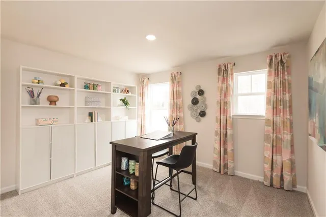 a view of a livingroom with furniture and window