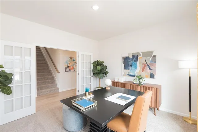 a view of a workspace with furniture