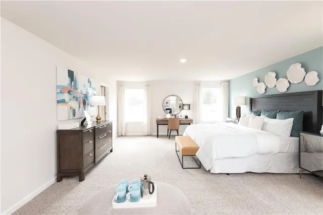 a spacious bedroom with a bed and a chandelier