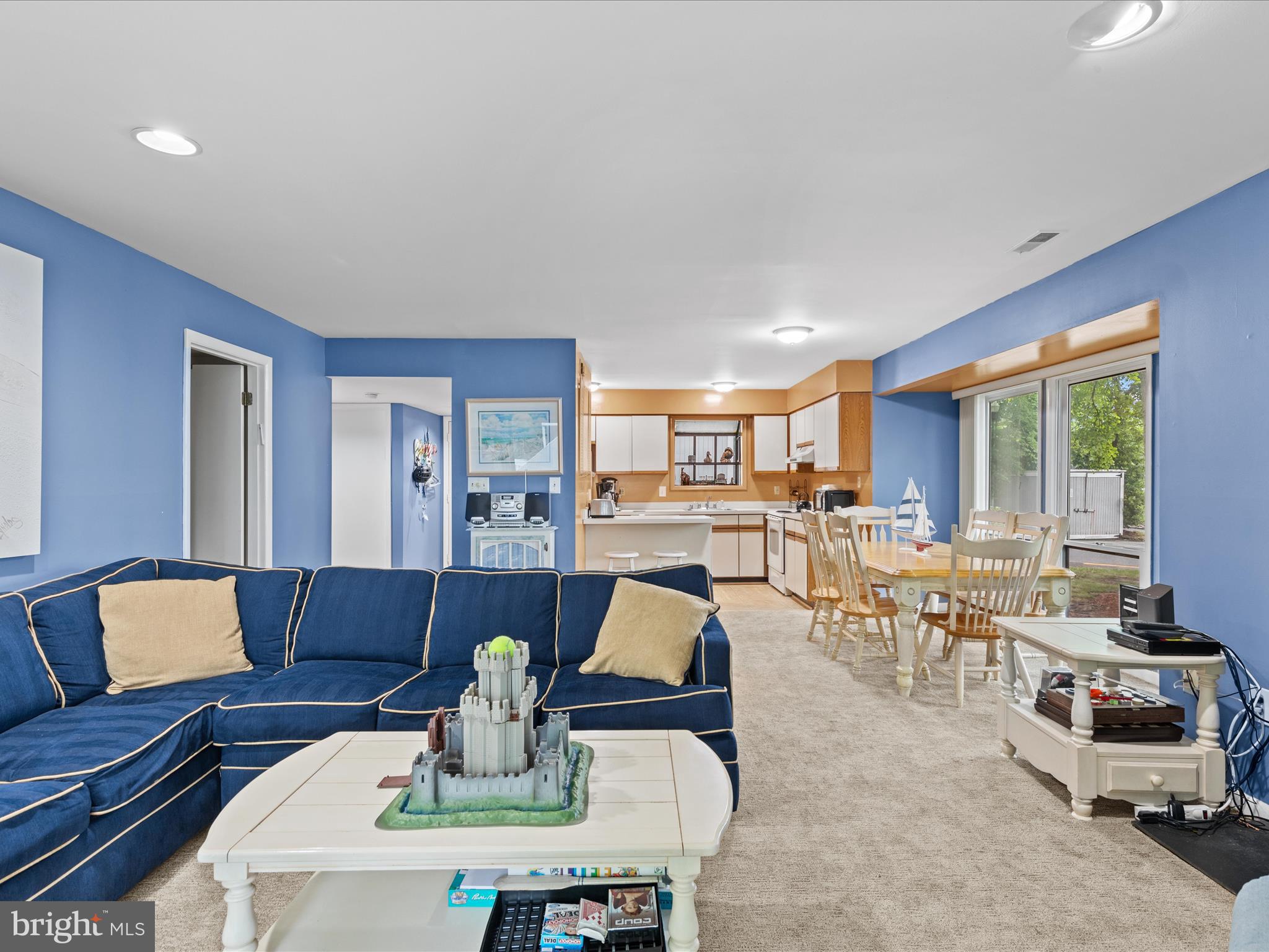 39346 Racquet Lane, Unit 8502 Bethany Beach, DE 19930 - Photo 15 of 33 a living room with furniture and wooden floor