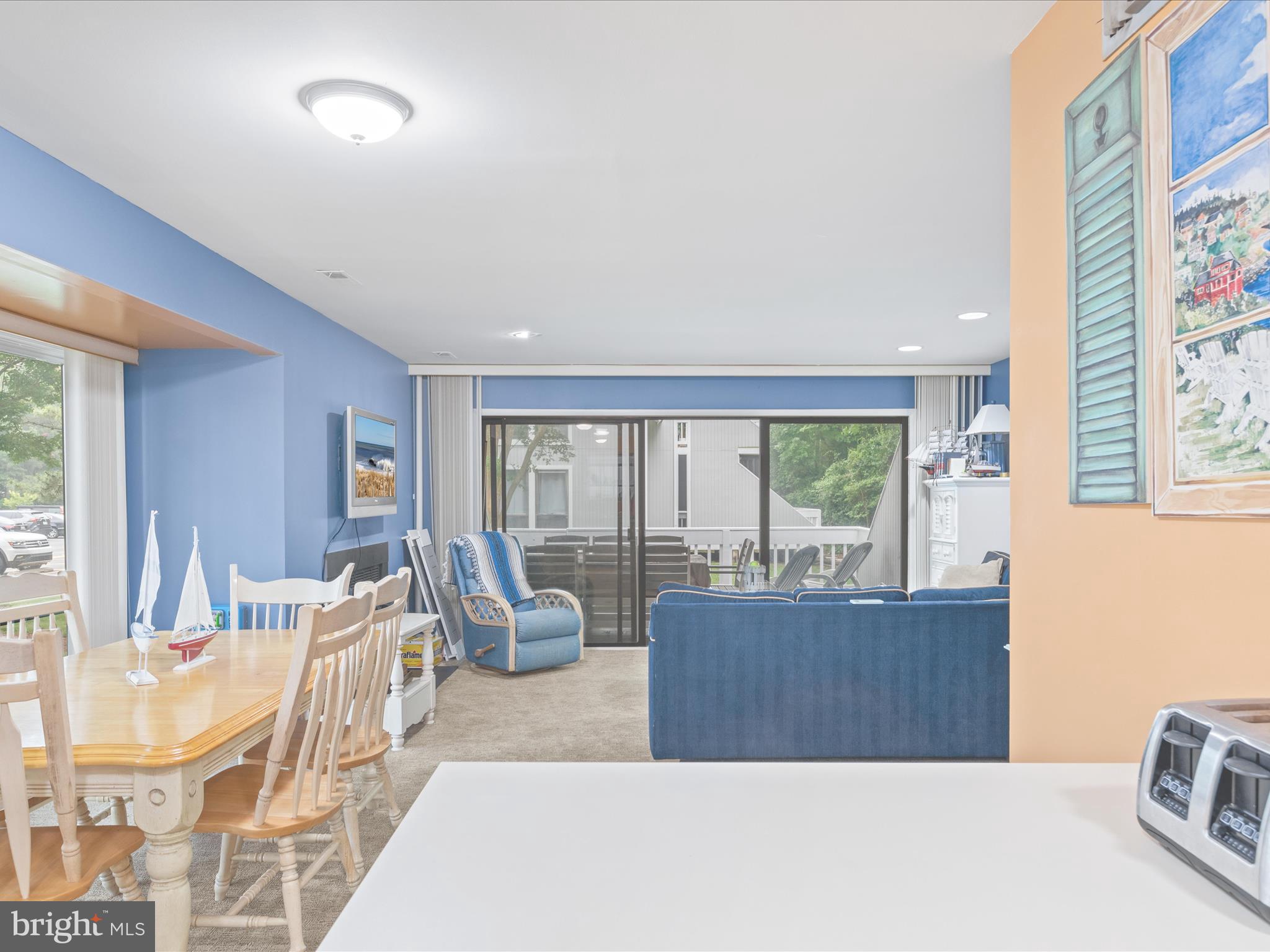 39346 Racquet Lane, Unit 8502 Bethany Beach, DE 19930 - Photo 17 of 33 a living room with furniture and a large window