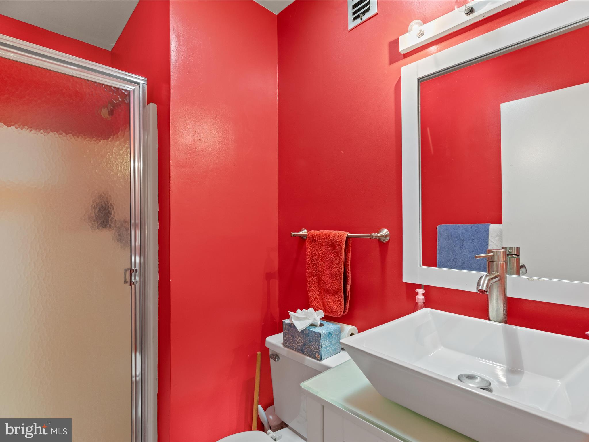 39346 Racquet Lane, Unit 8502 Bethany Beach, DE 19930 - Photo 22 of 33 a bathroom with a sink and a mirror