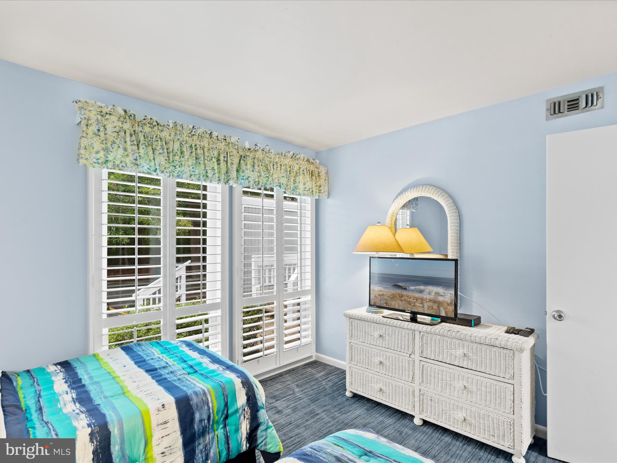 39346 Racquet Lane, Unit 8502 Bethany Beach, DE 19930 - Photo 26 of 33 a bedroom with a bed and a television