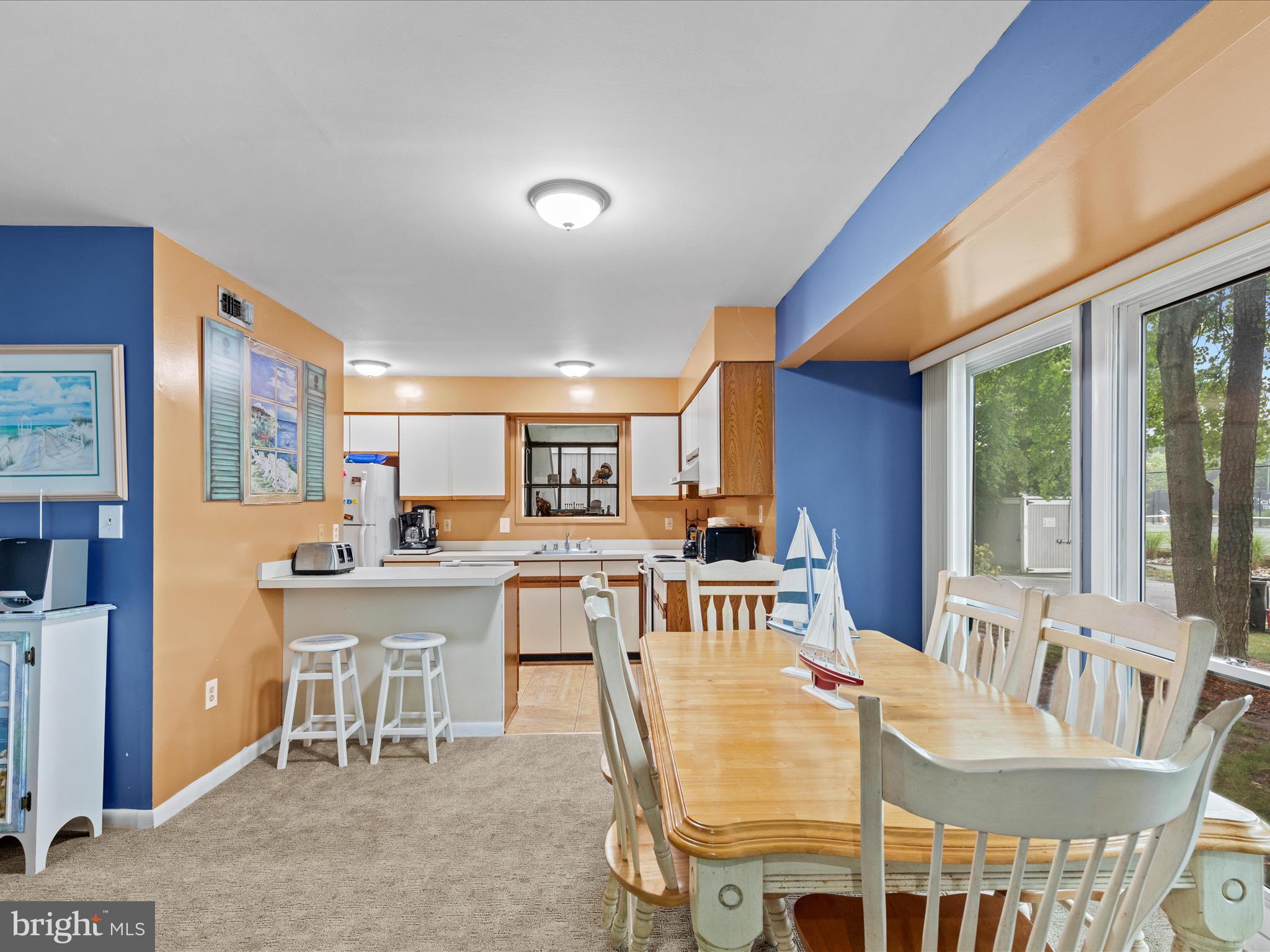 39346 Racquet Lane, Unit 8502 Bethany Beach, DE 19930 - Photo 8 of 33 a view of a dining room with furniture window and outside view