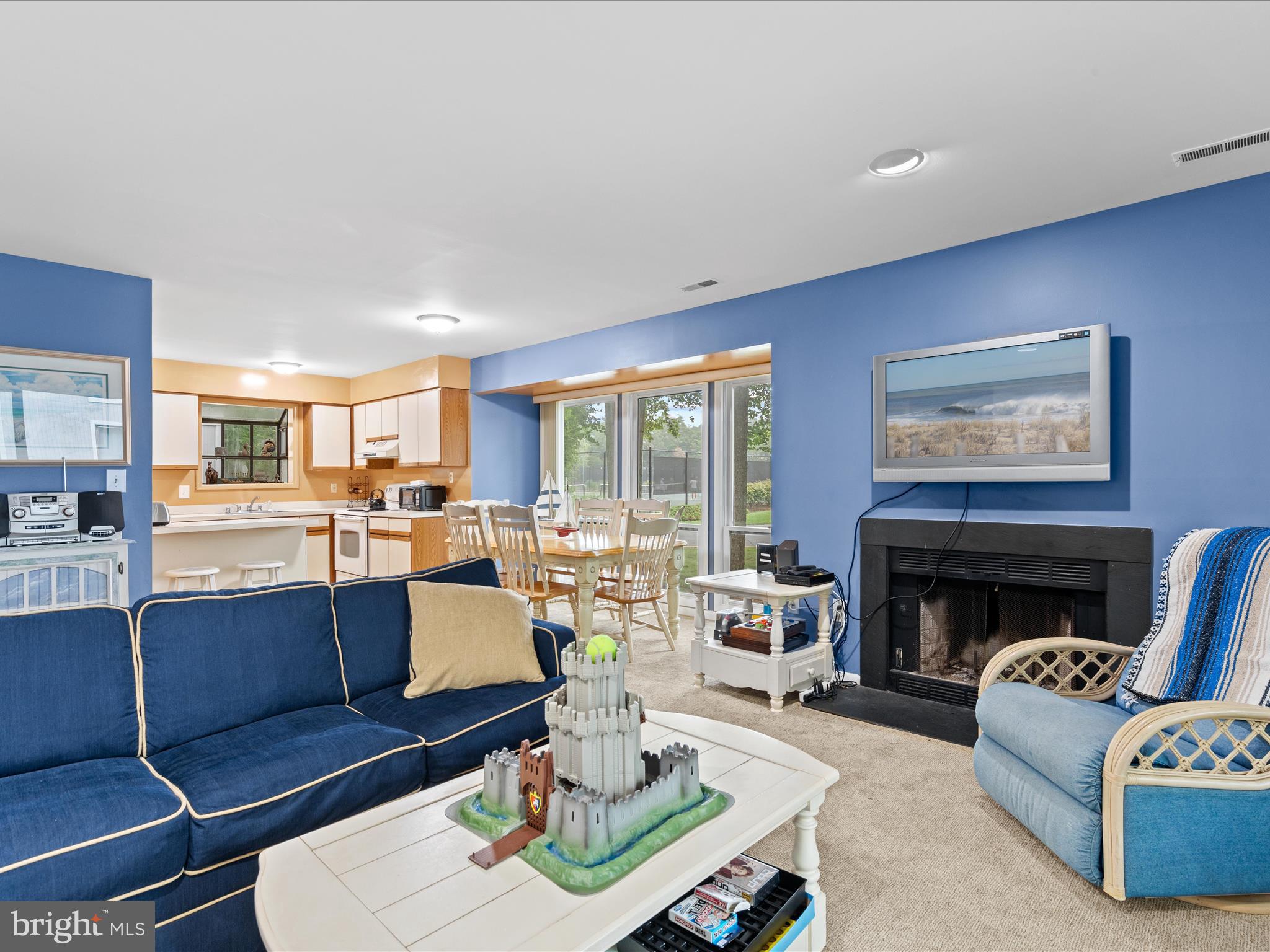 39346 Racquet Lane, Unit 8502 Bethany Beach, DE 19930 - Photo 10 of 33 a living room with furniture and a fireplace