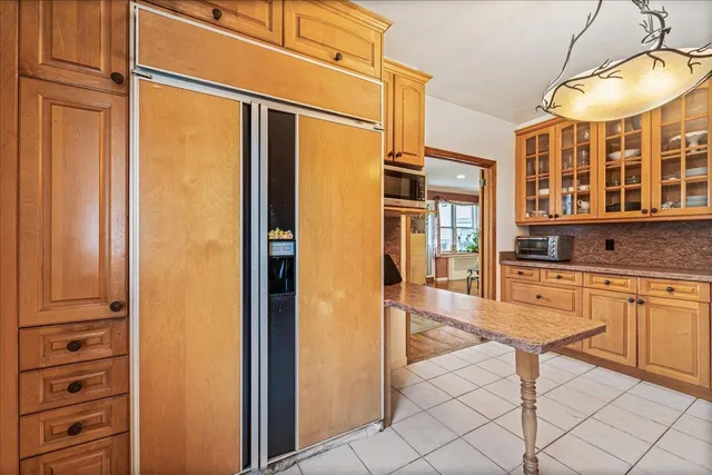 a spacious bathroom with a granite countertop sink and a large mirror
