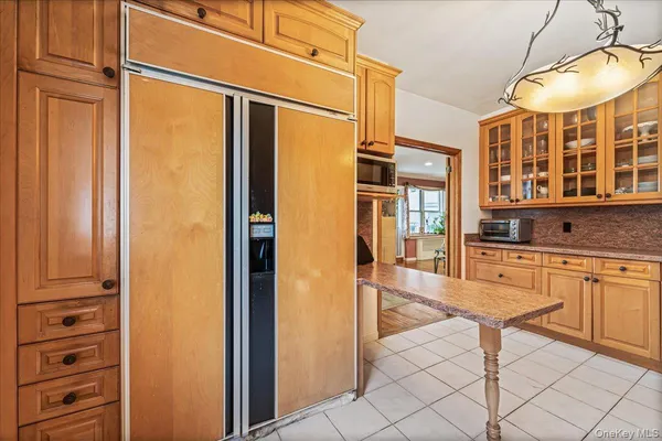 a spacious bathroom with a granite countertop sink and a large mirror