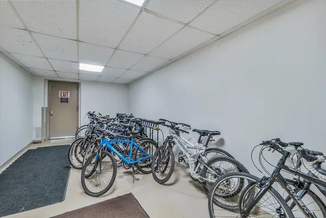 an aerial view of a house with a garden and lake view