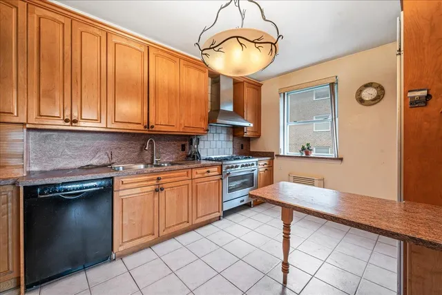 a kitchen with granite countertop cabinets and window