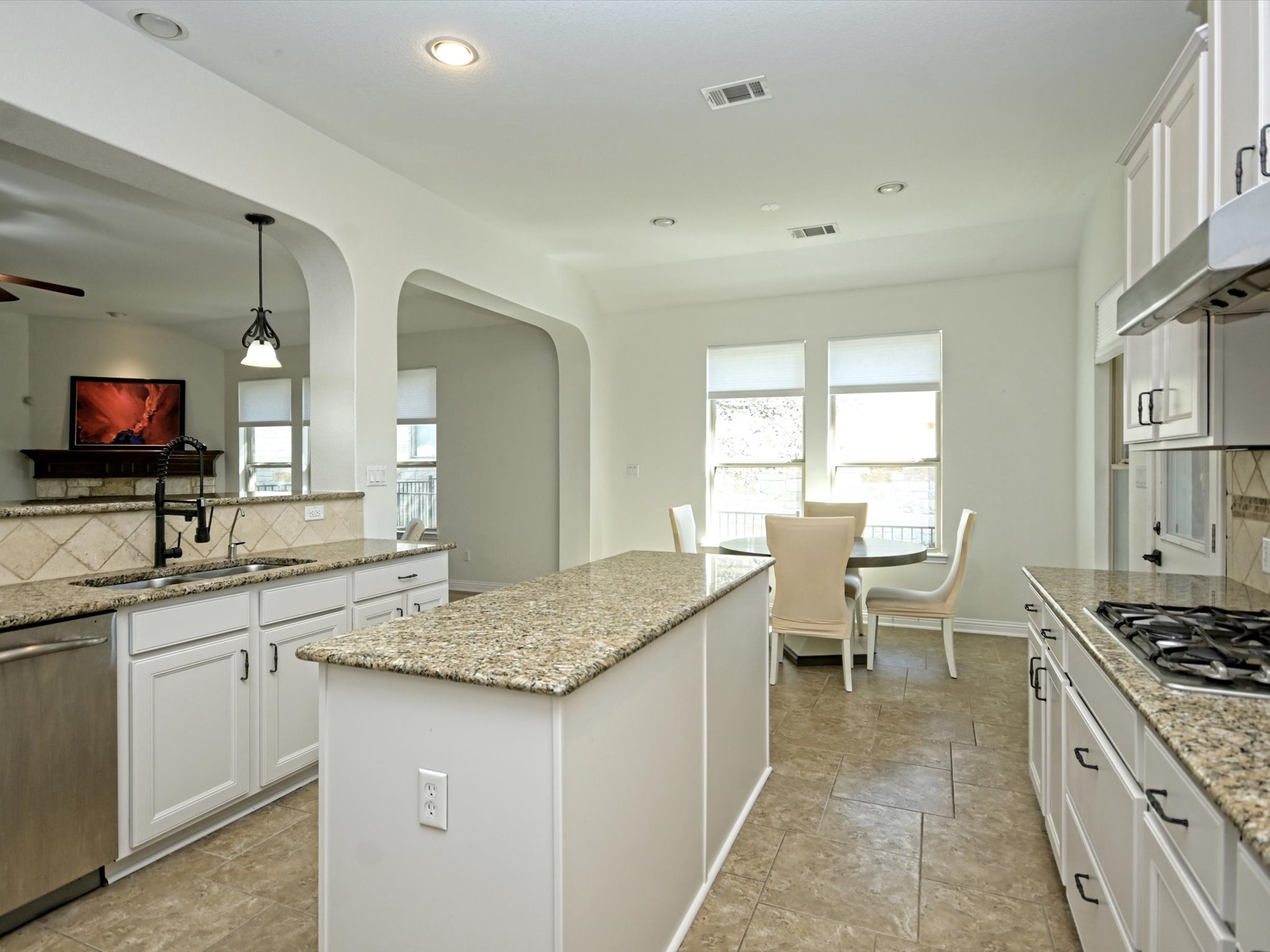 201 Bellagio Drive Austin, TX 78734 - Photo 11 of 31 The kitchen is well-equipped with granite countertops, stainless steel appliances, and a large center island.