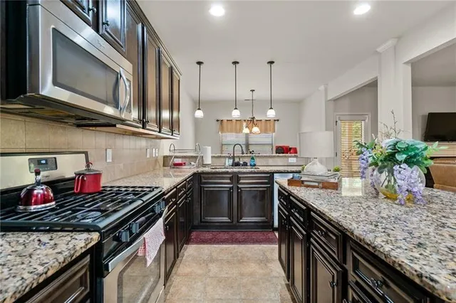 a bathroom with a shower and a sink a mirror