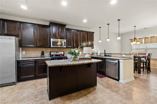 a bathroom with a double vanity sink and mirror