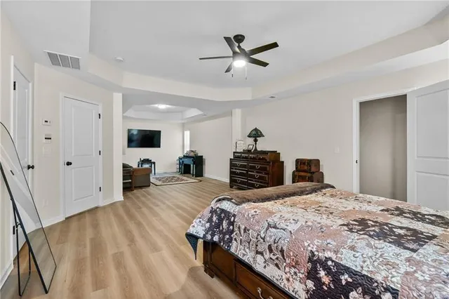 a bedroom with a bed and a table in it