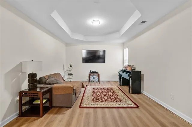a view of a house with a yard patio and a fire pit