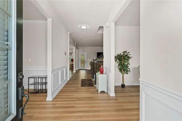a view of a dining room with furniture window and wooden floor