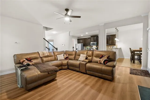 a view of a dining room with a table and chairs
