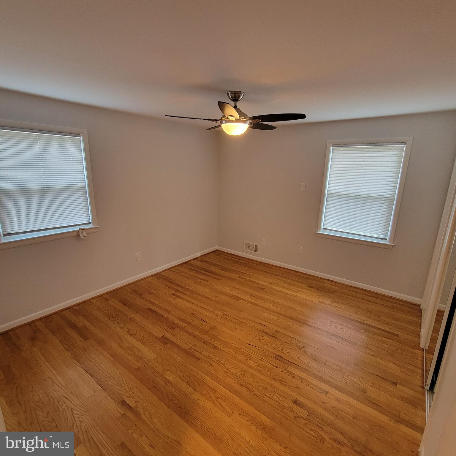 18320 Metz Drive Germantown, MD 20874 - Photo 11 of 31 a view of empty room with wooden floor