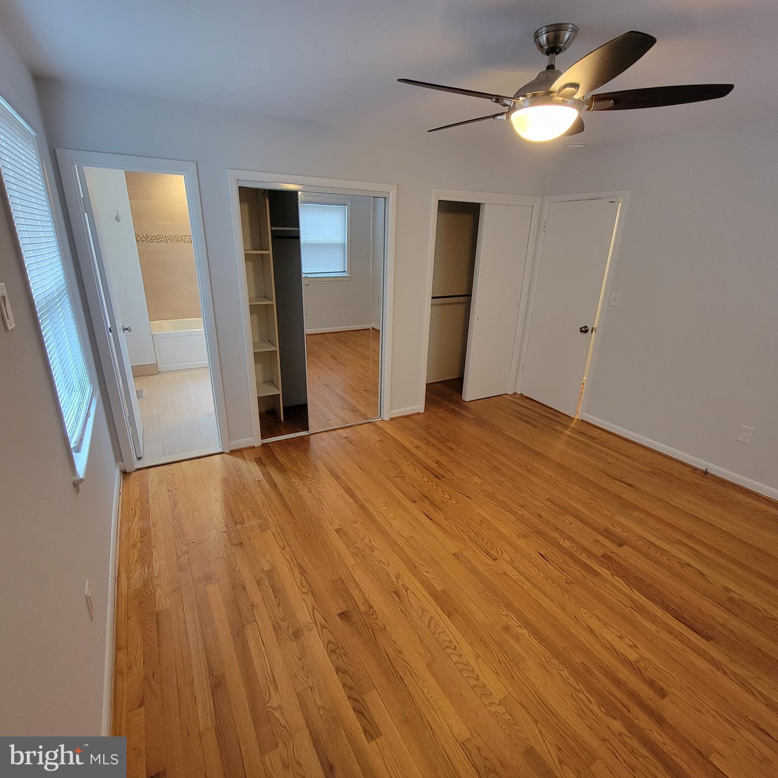 18320 Metz Drive Germantown, MD 20874 - Photo 12 of 31 a view of empty room with wooden floor and fan
