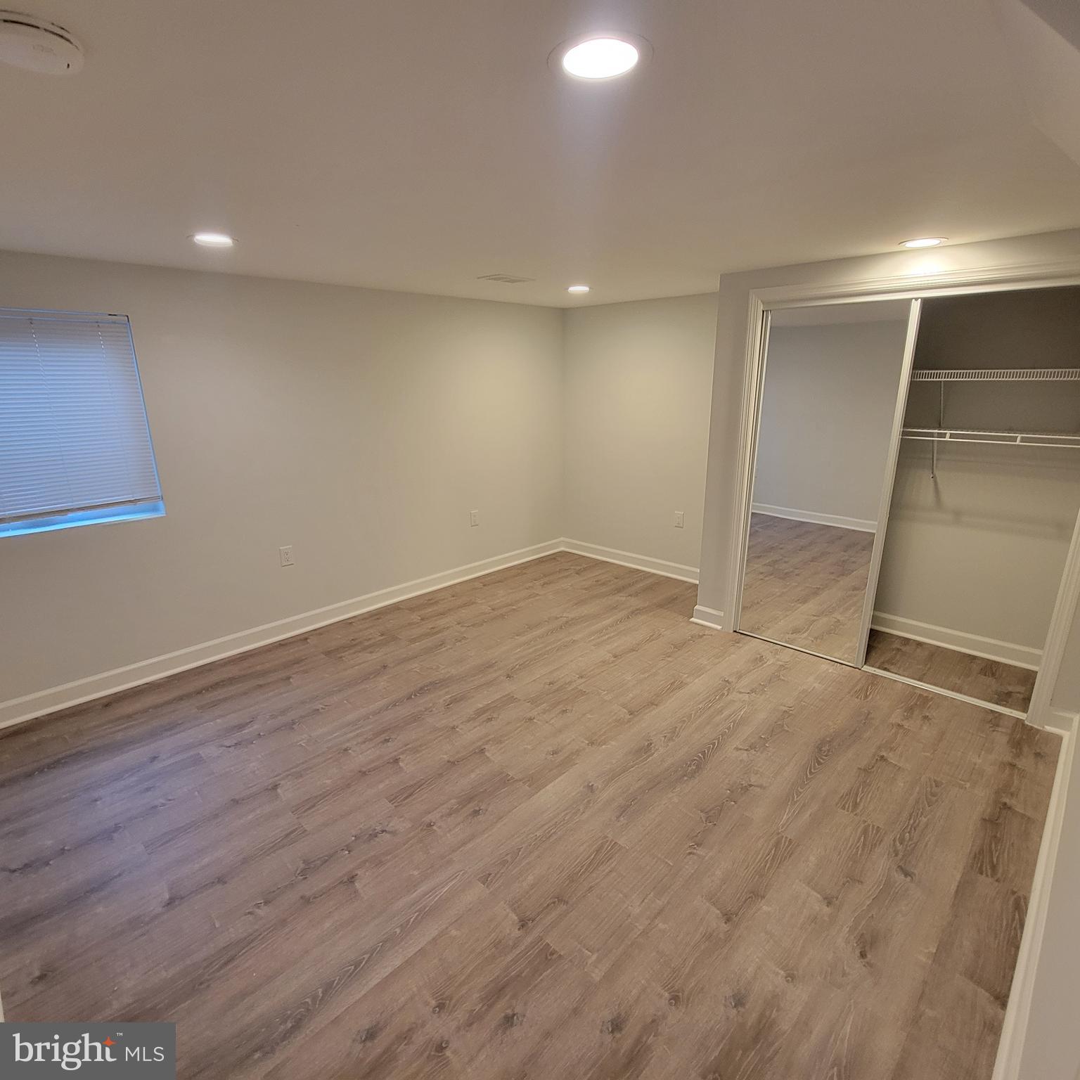 18320 Metz Drive Germantown, MD 20874 - Photo 20 of 31 en empty room with wooden floor
