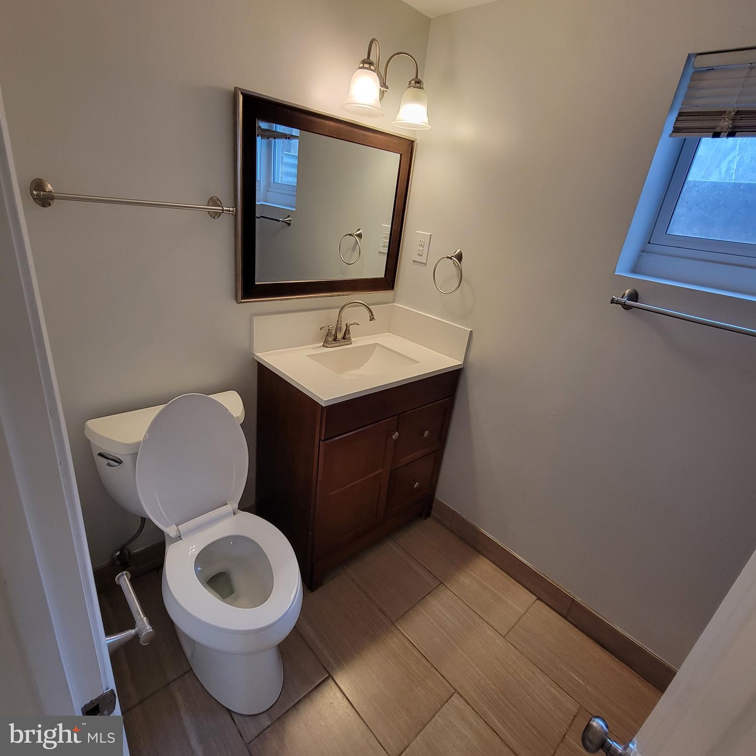 18320 Metz Drive Germantown, MD 20874 - Photo 21 of 31 a bathroom with a toilet sink and mirror