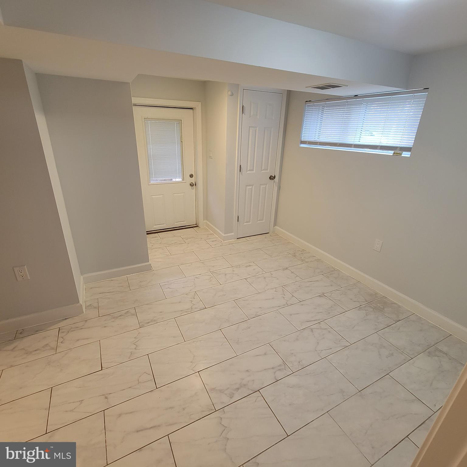 18320 Metz Drive Germantown, MD 20874 - Photo 24 of 31 an empty room with white walls and tiles